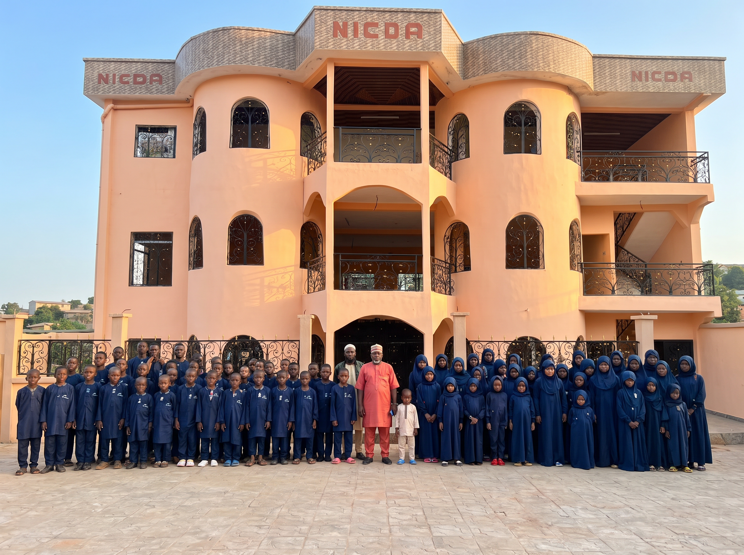 NICDA members and pupils gathered outside the school